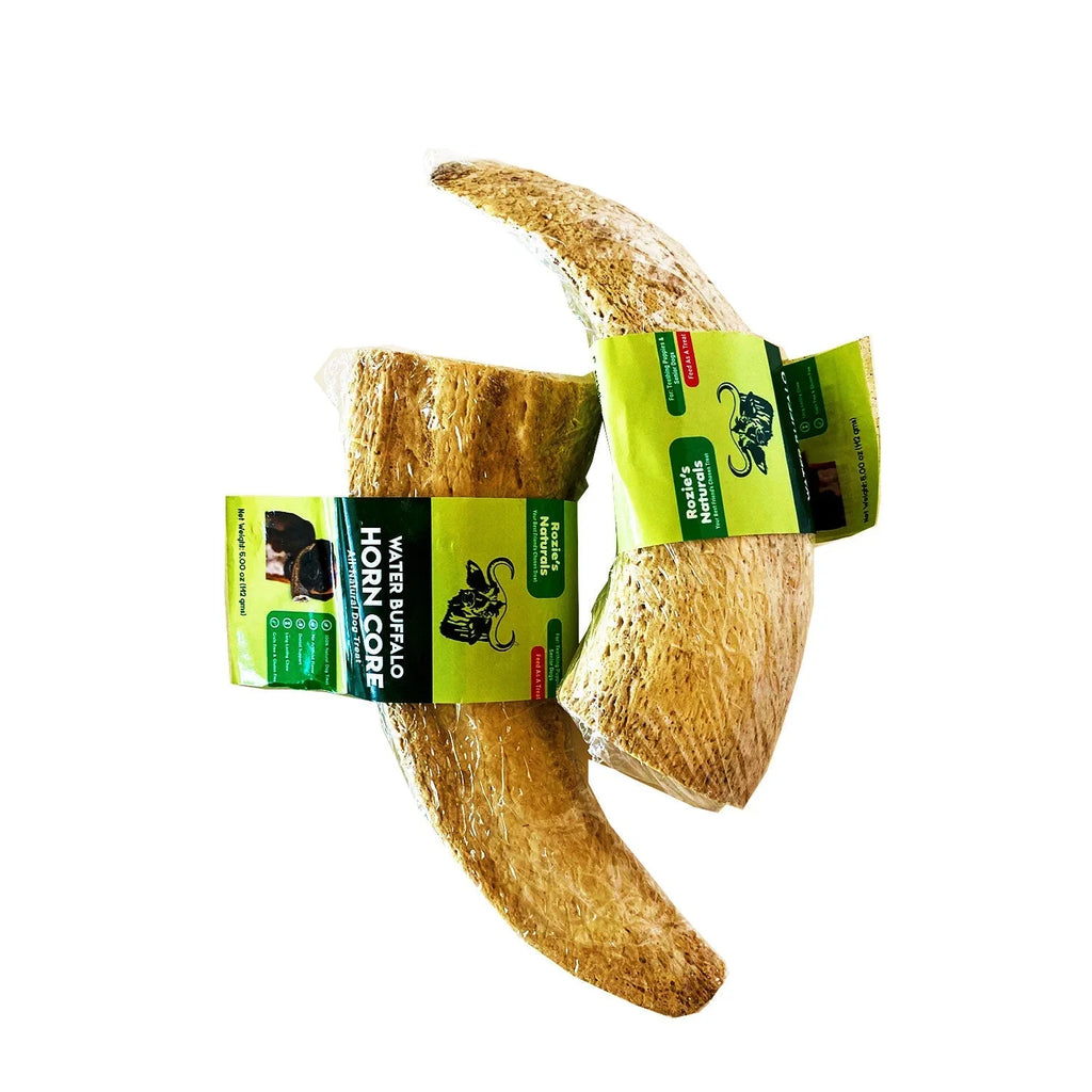 Water buffalo horn core dog treats wrapped in clear plastic with green Rozie's Naturals labels