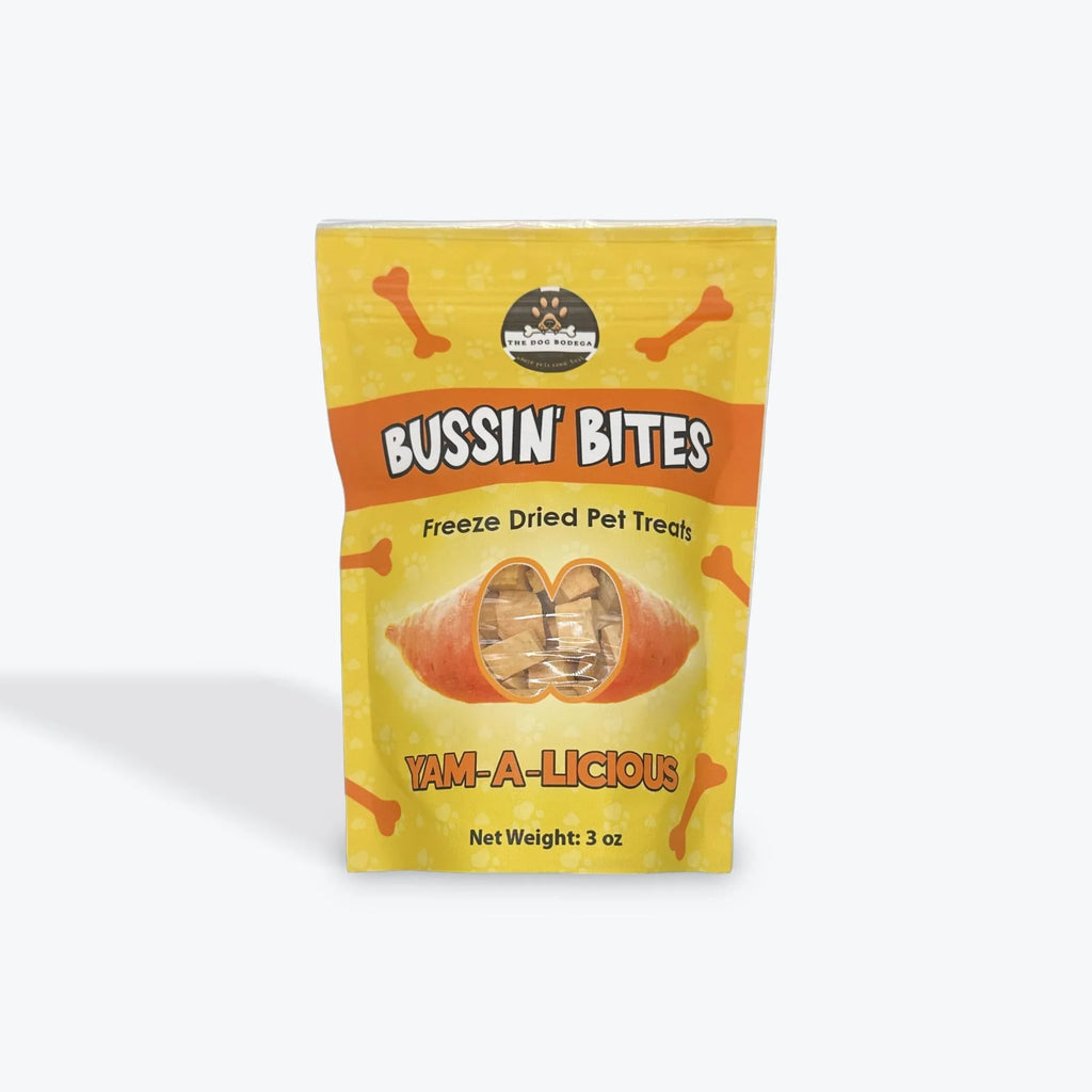 Bussin' Bites Yam-A-Licious freeze dried pet treats in yellow and orange packaging with dog bone designs