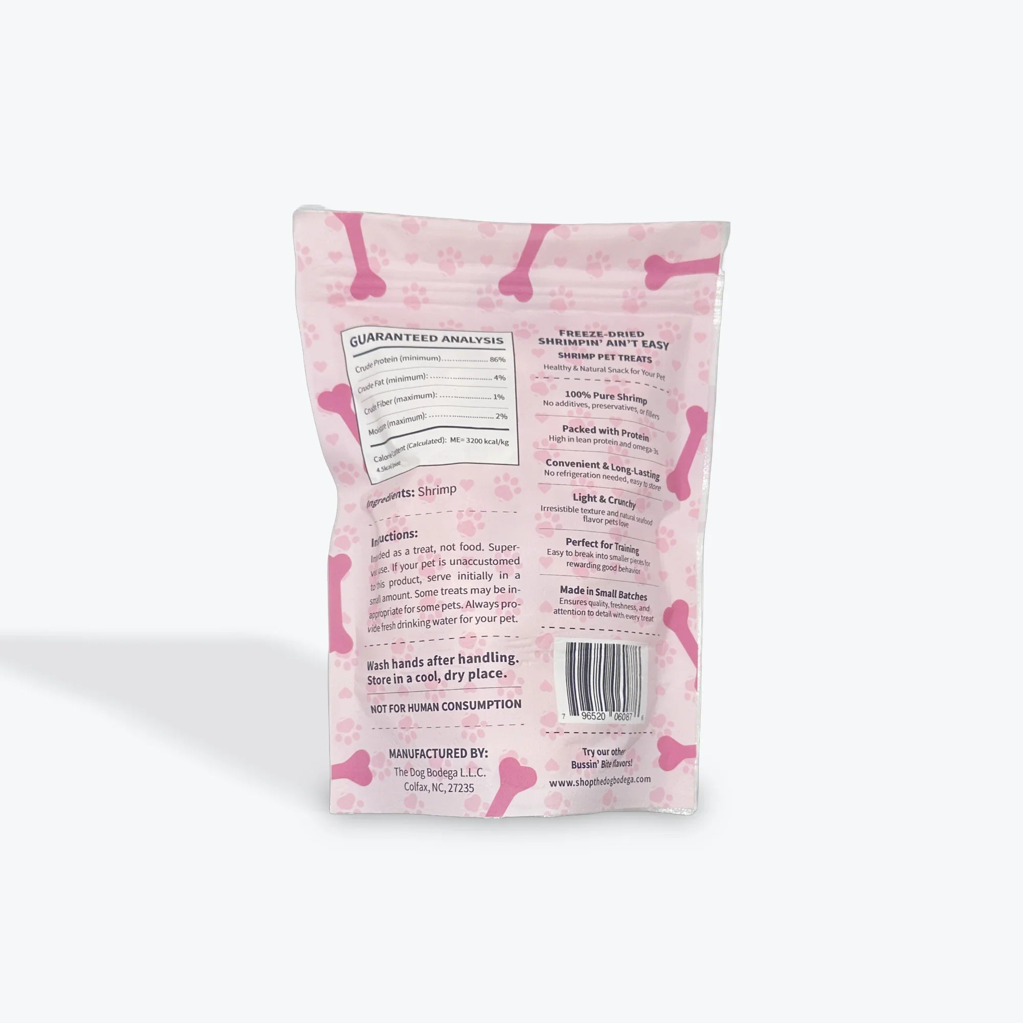 Back of pink dog treat bag with bone and paw prints, freeze-dried shrimp pet treats information