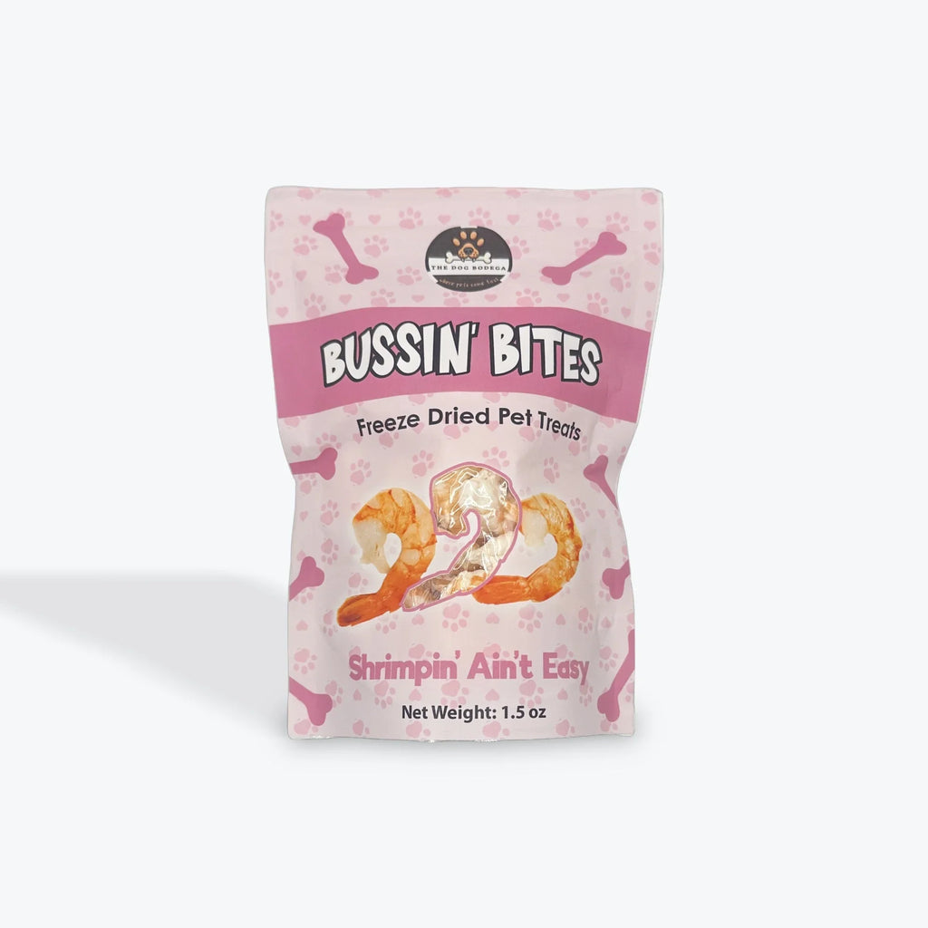 Bussin' Bites freeze dried shrimp pet treats in pink bag with bone and paw print design