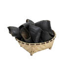 Water Buffalo Hooves Dog Chews in a woven basket on a white background.