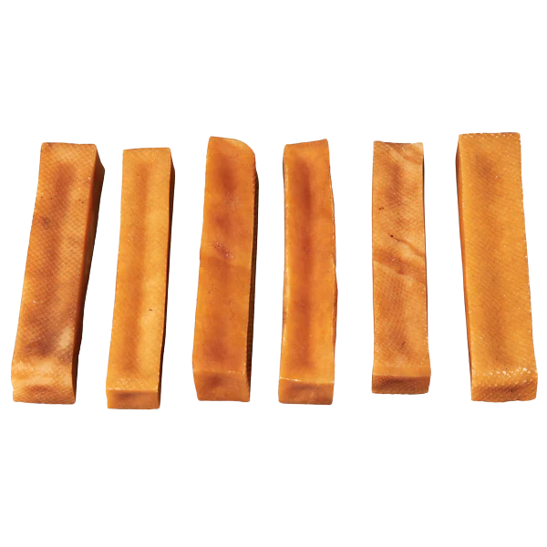 Six dog churpi cheese chews on a white background