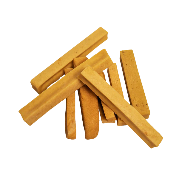 Stack of dog churpi cheese chews on a white background