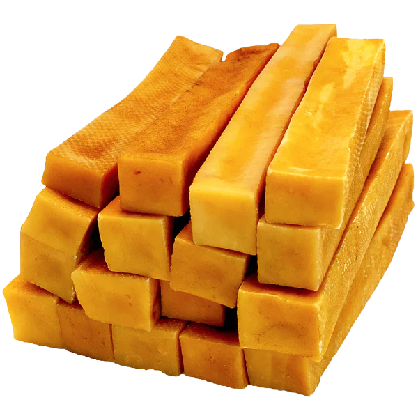 Stack of dog churpi cheese chews on a white background