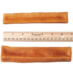 Two pieces of dog churpi cheese chews next to a ruler on a white background